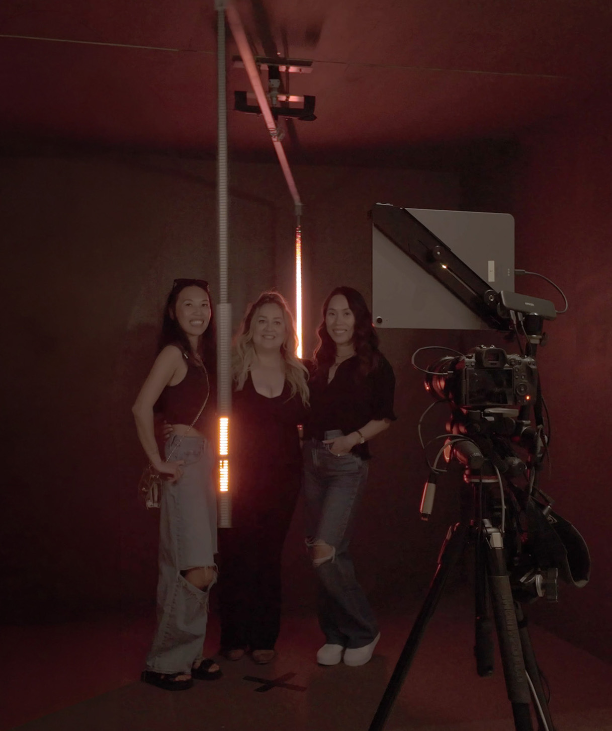 Guests posing for a custom light painting photobooth experience.