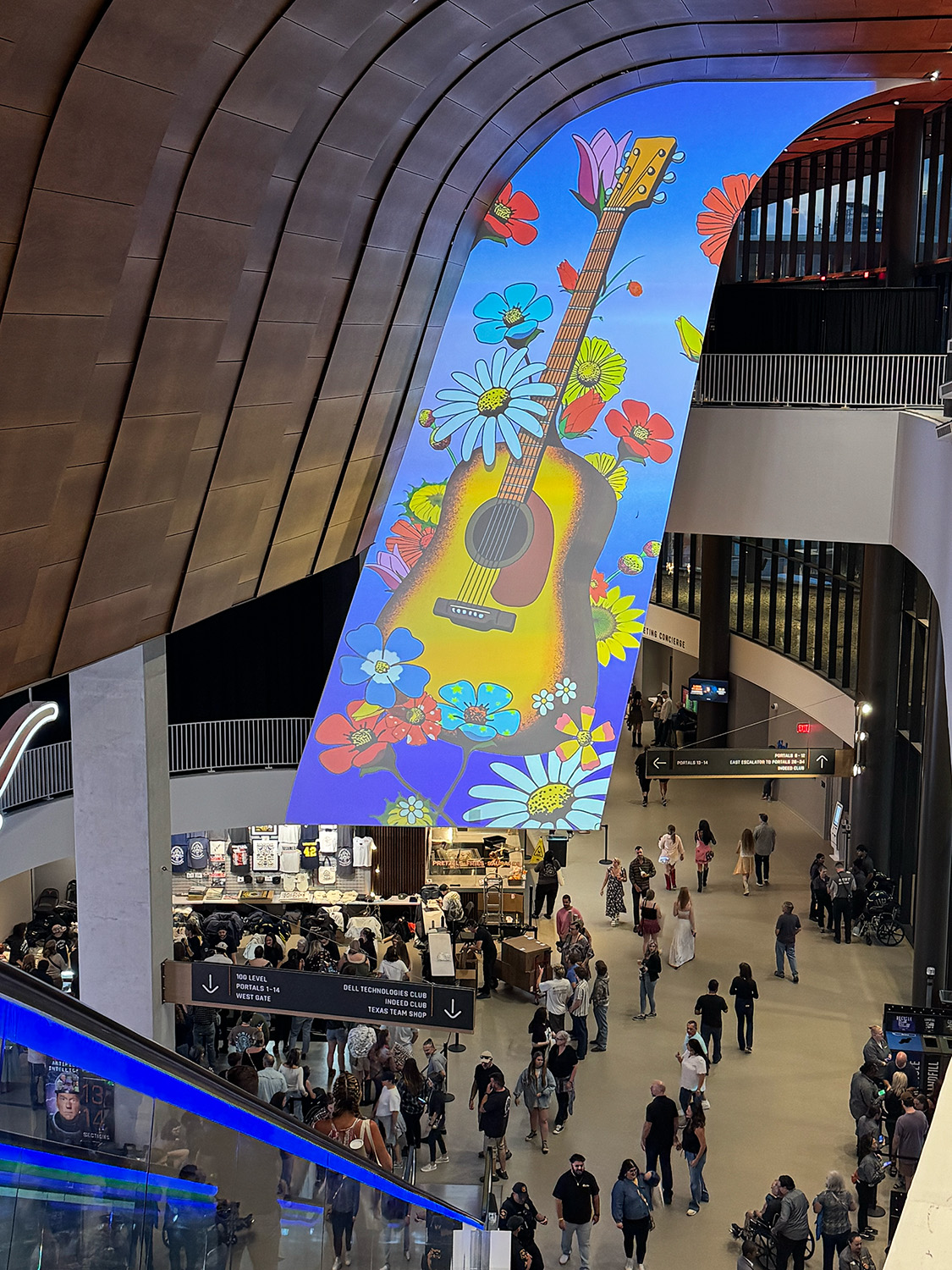 Projection-mapped architectural wall inside Moody Center in Austin.
